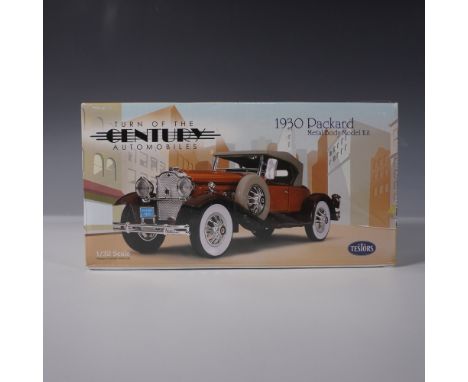 This Testors 1/32 scale metal body model kit features a 1930 Packard, part of the Turn of the Century Automobiles series. The