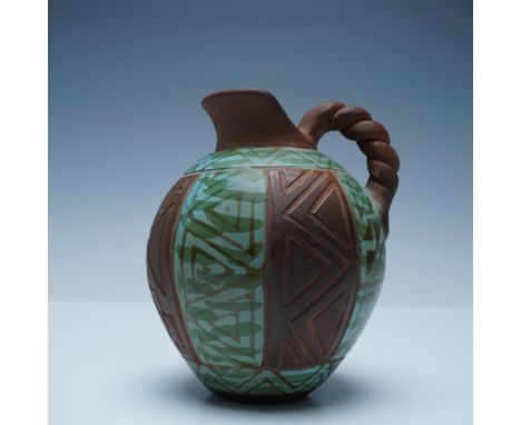 A beautifully handcrafted Peruvian pottery pitcher signed Santdoc Paz and marked Hand Made in Peru on the underside. This str