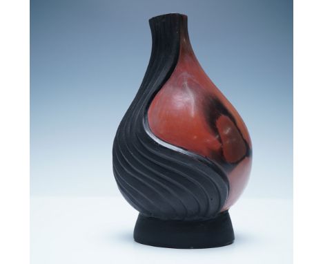 A striking handcrafted pottery vase signed R. Crisanto, featuring a bold contemporary swirl design. The piece presents a dyna