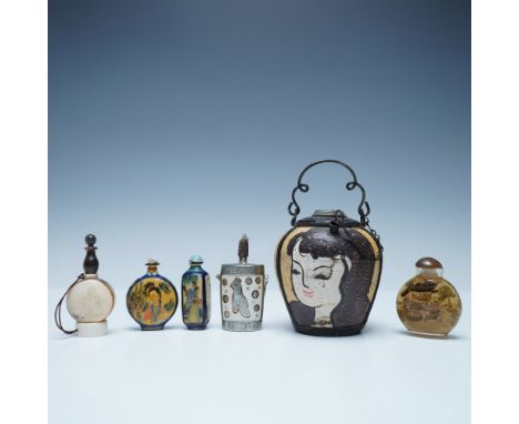 A curated collection of six antique and vintage Chinese snuff bottles alongside a unique painted oil lamp or incense burner. 