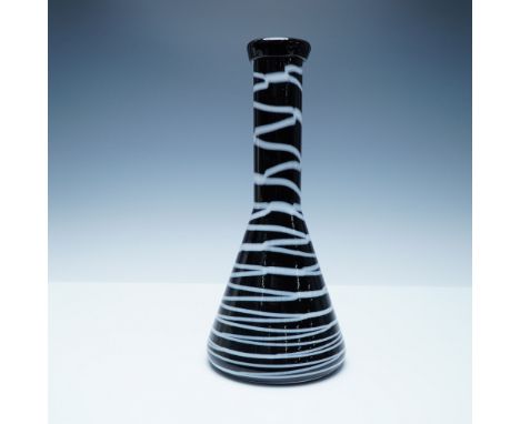 A striking black and white beaker-shaped art glass vase with a sleek, modern silhouette. This hand-blown piece features a glo