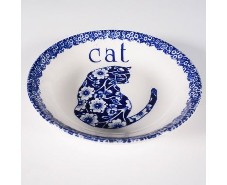 A charming Staffordshire Burleigh Calico Cat dish featuring a blue floral-patterned cat silhouette with the word "Cat" in bol