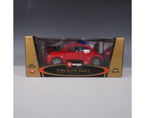 A detailed 1:18 scale die-cast model of the 1998 Volkswagen New Beetle by Bburago, part of the Gold Collection. This high-qua