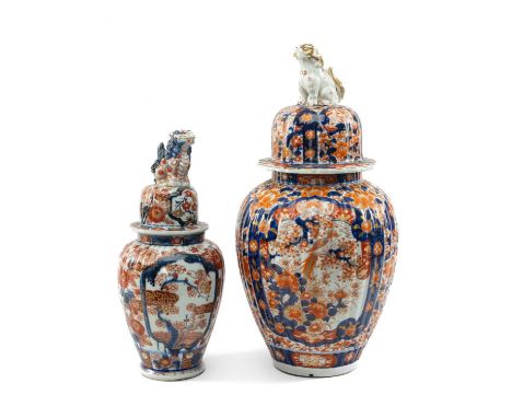 TWO JAPANESE IMARI VASES & COVERS, Meiji Period, both with seated karashishi knops to the domed covers and lobed oviform base