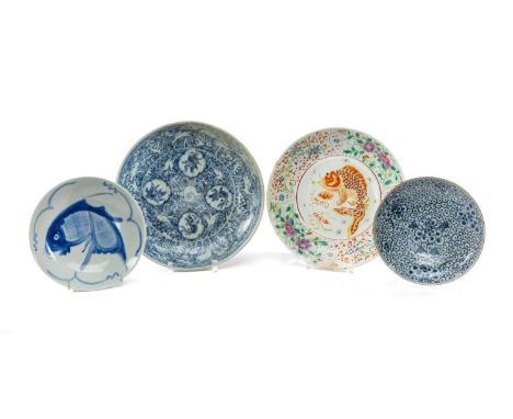 FOUR CHINESE PORCELAIN DISHES, including three blue & white saucers, one painted with leaping carp panels on a horse-in-waves