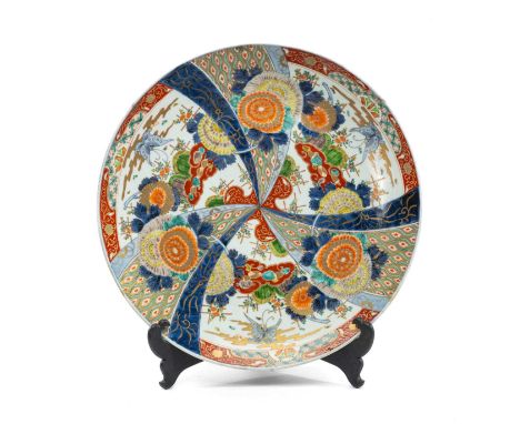 JAPANESE IMARI PORCELAIN CHARGER, Meiji Period, decorated in 5-colours with radiating panels of butterflies above kiku and ot