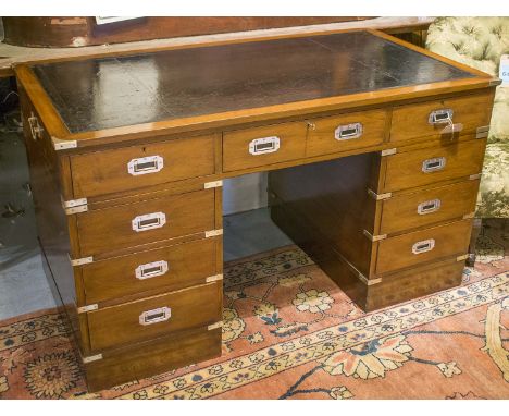 PEDESTAL DESK, campaign style mahogany and brass bound with nine drawers and tooled leather top, 74cm x 135cm x 77cm H.