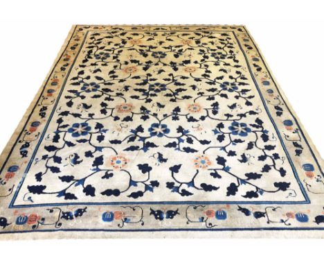 ANTIQUE CHINESE PEKING CARPET, 347cm x 270cm, all over flower head, vine and butterfly design, within a complimentary main bo