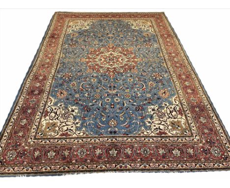 FINE ISPHAHAN DESIGN CARPET, 358cm x 245cm, central medallion on a sky blue field of palmettes and vines within complimentary