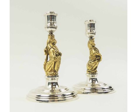 ROYAL JUBILEE (1952-1977) COMMEMORATIVE SILVER CANDLESTICKS, makers Garrard and Co. Ltd, silver gilt stems modelled lion of E