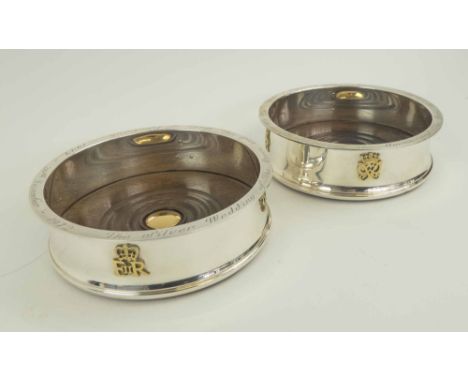 PAIR OF GARRARD & CO. WINE COASTERS, commemorating the Queen's Silver Wedding, limited edition, 338/1000, London 1972, turned