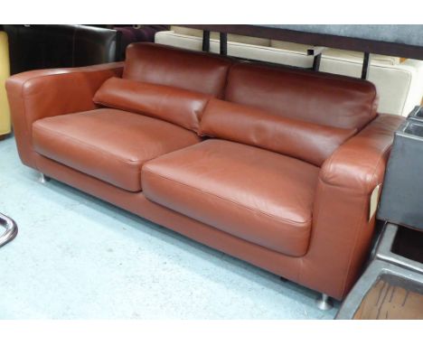 LIGNE ROSET SOFA, reclining in burgundy leather with bolster cushions, 190cm x 88cm x 76cm H. 