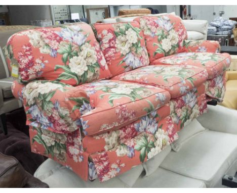 RALPH LAUREN SOFA, three seater, in a floral pattern on a red ground on square supports, 207cm L. 