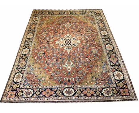 MASHAD CARPET, 318cm x 235cm, pendant medallion on a terracotta palmette and vine field, within complimentary spandrels and b