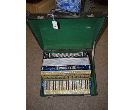 A piano accordion, by Tandoral, in fitted case.