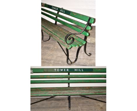 A Southern Railways bench from the Tower Hill Station, mounted with associated plastic plaque inscribed "Tower Hill"; togethe
