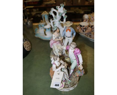 A reproduction Staffordshire style figure of a courting couple beside a tree; and a Continental ware figure of a courting cou