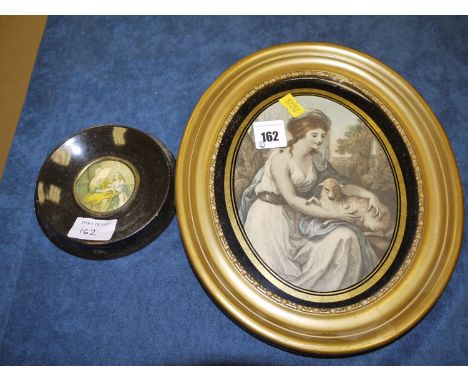 A 19th Century hand-coloured print of a female figure holding a lamb, in oval gilt frame; together with a miniature print, in