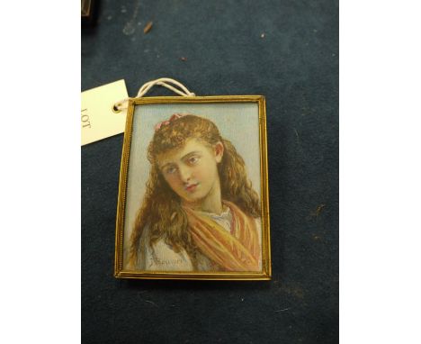 An early 20th Century miniature portrait on ivory of a young girl, signed J. Bouvier.