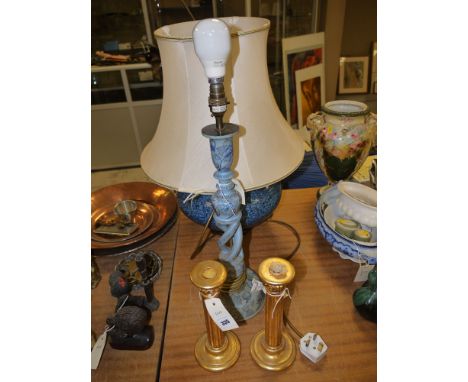 A large globular ware table lamp with mottled blue decoration, with cream shade; a spiral twist standard lamp, without a shad