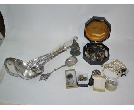 Plated cutlery, including: two ladles, a gravy spoon, a fish server, and a smaller ladle; a white metal Dutch style spoon wit