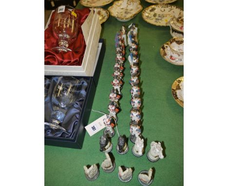 Modern hand-painted resin chess pieces modelled as soldiers and horses.