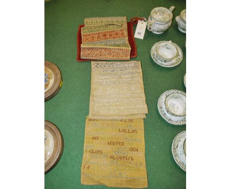 A small rectangular tapestry panel depicting a cat; and three needlework samplers inscribed 'Bridget Foster, 1743'; together 