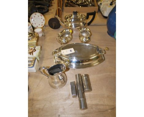 A three-piece oval plated tea service; and oval entree dish and cover; a Britannia metal jug; and three small plated items.