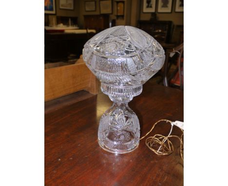 A cut glass table lamp.