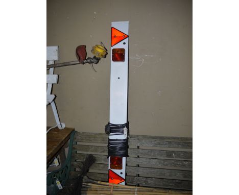 A lighting board for a trailer; and a chimney sweep brush.
