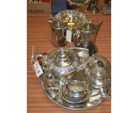 A three-piece silver plated tea service; a circular tray; sugar sifter; two coffee pots; a decorated teapot; etc.