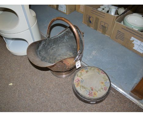 A 19th Century copper coal scuttle; and a circular footstool with tapestry upholstery.  (2)