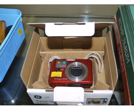 A modern digital camera Model A1455 in original box.