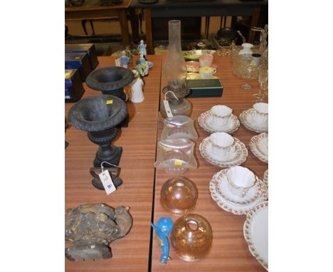 A Victorian glass oil lamp; two Vaseline glass shades; together with two glass shades; and a damaged bird ornament.