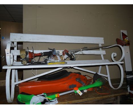 A wooden garden bench with metal arms and supports.