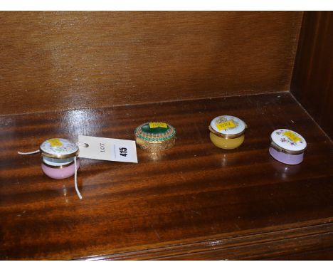 Two circular and one oval enamel patch boxes by Crummels; and another oval patch box with green glass hinged cover.  (4)