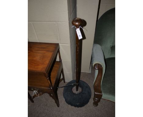 An early 20th Century shoe and boot scraper, comprising: a circular finial on a turned pole, with a metal boot scraper and a 