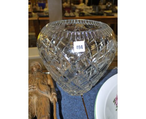 A large heavily cut circular tapering glass vase with trellis pattern decoration and star cut base.