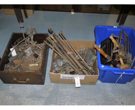 A collection of hinges, spray pumps, fret saws and other tools, in three boxes.