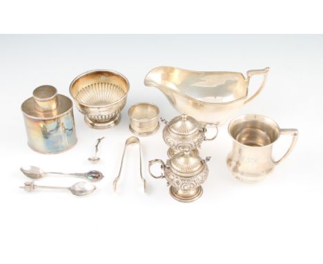 A lot to include a pair of silver mustard pots, of squat baluster form with repousse floral scroll design, complete with glas