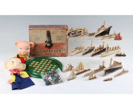 A lot to include; boxed Chad Valley microscope kit, nineteen wooden cut out ships, possibly Chad Valley, solitaire with glass
