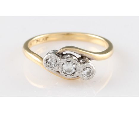 An 18ct yellow gold diamond ring, illusion set with three 8 cut diamonds in a platinum setting, approx. 0.09ct total, stamped
