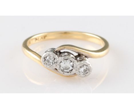 An 18ct yellow gold diamond ring, illusion set with three 8 cut diamonds in a platinum setting, approx. 0.09ct total, stamped