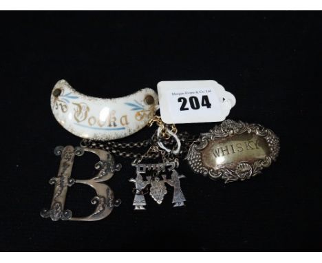 Three Silver Decanter Labels And One Other