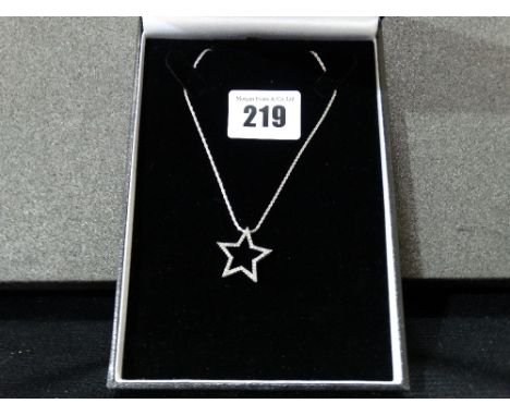A 14ct White Gold Diamond Set Star Pendant And Chain