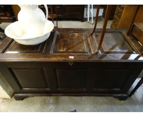 An Antique Oak Three Panel Coffer On Bracket Feet