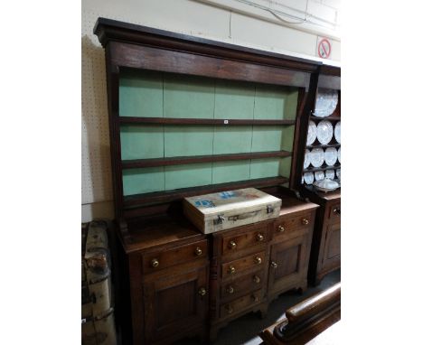 An Antique Oak And Mahogany Anglesey Dresser Having A Three Shelf Rack With Diamond And Dot