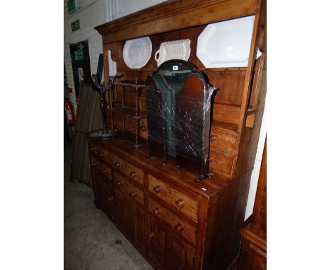 An Antique Pine Kitchen Dresser Having A Two Shelf Rack With Bank Of Spice Drawers, The Base Having Six Drawers With Two Side