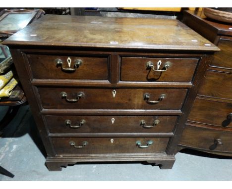 An Antique Oak Chest Of Two Short And Three Long Drawers, On Bracket Feet