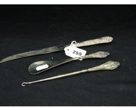 A Silver Handled Shoe Horn And Button Hook Together With A Silver Handled Bread Knife